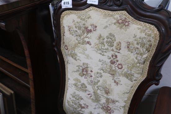 A 19th century carved mahogany framed nursing chair